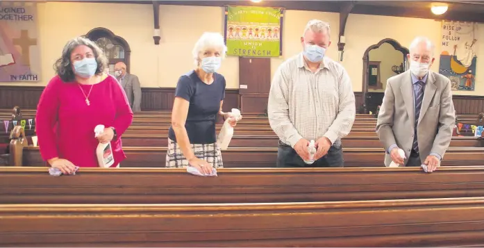  ??  ?? Caption in here
Covid rules Pamela Howat, Ruth Brand, Phil Murrie and Archie Mitchell were some of the cleaning crew after morning worship on Sunday at Blairgowri­e Parish Church. Pic: David Phillips