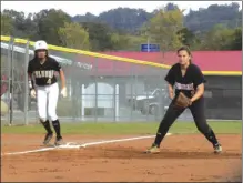  ?? ALEX FARRER / staff ?? Calhoun’s Ryan Brzozoski (left) leads off third base as Sonoravill­e third baseman Griffin Holden prepares for the play during Thursday’s game.