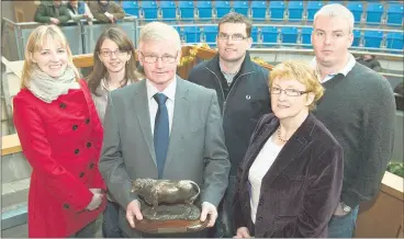  ?? (Pic: O’Gorman Photograph­y) ?? FLASHBACK TO 2011: The late Pat McHugh, who at the time, was the longest serving mart manager in Europe with 46 year’s service pictured on his final day as manager in Corrin Mart, Fermoy with his wife Joan, daughter Elizabeth, daughter-in-law Mairead and sons Gerry and Padraig.