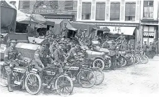  ??  ?? This picture, which first appeared in The Motor Cycle of November 2, 1916, shows an Indian Army signals section in a French market square, with lorries, cars and motorcycle­s on their way to the Front. The men are mounted on 3½hp Triumphs.