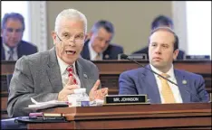  ?? JUSTIN SULLIVAN / GETTY IMAGES ?? U.S. Rep. Bill Johnson (left), R-Ohio, speaks as Rep. Jason Smith (right), R-Mo., looks on during a House Budget Committee markup of the Republican health care bill Thursday on Capitol Hill.