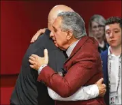  ??  ?? Falcons owner Arthur Blank gives Dan Quinn a hug at the end of Sunday’s postgame news conference, but will he still be embracing the coach by season’s end?