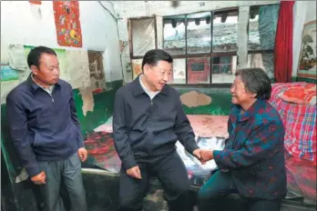  ?? PANG XINGLEI / XINHUA ?? President Xi Jinping visits a family in the mountainou­s village of Zhaojiawa, Kelan county, during his Shanxi inspection tour on Wednesday. He and the CPC are trying to lift families from poverty and to help them get rich.