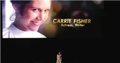  ??  ?? An image of the late Carrie Fisher is displayed as Sara Bareilles performs during the Memoriam tribute at the Oscars.