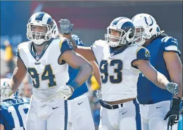  ?? Wally Skalij Los Angeles Times ?? ROBERT QUINN (94) celebrates a sack with Ethan Westbrooks during Rams’ 2017 opener at the Coliseum.