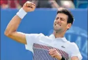  ?? AFP ?? Djokovic celebrates after beating Monfils in the final.