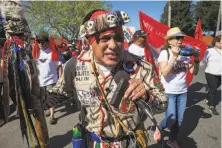  ??  ?? Ventura Longoria chants, “Sí, se puede” (roughly, “Yes, we can”), at the march, which honored labor leader Cesar Chavez.