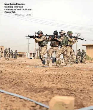  ?? MIKE SCOTT/STUFF ?? Iraqi-based troops training in urban clearances and tactics at Camp Taji.