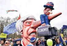  ?? NEIL HALL EPA-EFE ?? A FLOAT depicting British Prime Minister Theresa May is seen during the ‘Put it to the People’ march in London, Britain, yesterday. Hundreds of thousands of people took part in the protest calling for a referendum on the final Brexit deal. |