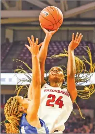  ?? CRAVEN WHITLOW/NATE Allen Sports Service ?? Razorback junior forward Taylah Thomas, 24, goes up for two against New Orleans Friday morning at Bud Walton Arena in Fayettevil­le. The Lady ‘Backs downed the Privateers 82-52 with Thomas scoring 10 points and bringing down a career-high 21 rebounds.