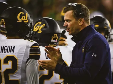  ?? Andy Nelson / Associated Press ?? Despite many blandishme­nts from Oregon, former Ducks defensive back Justin Wilcox has decided to remain Cal’s head coach.