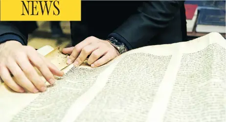  ??  ?? When the Sons of Israel Synagogue in Glace Bay, N.S., closed in 2010, its Torah scrolls, which are handwritte­n on parchment and weigh as much as 20 kilograms each, were put into storage. Now members are looking to give away the last of them, but want...