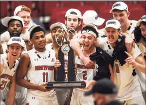  ?? Kassi Jackson / Associated Press ?? Hartford players celebrate after beating UMass-Lowell in the America East Tournament championsh­ip game March 13.