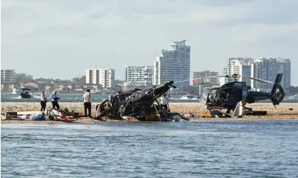  ?? Photograph: Dave Hunt/AAP ?? The wreckage of two helicopter­s after a collision near Sea World, on the Gold Coast of Australia.