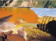  ?? BRENNAN LINSLEY/ASSOCIATED PRESS ?? Water flows through sediment retention ponds in August 2015 to reduce heavy metal and chemical contaminan­ts from the Gold King Mine accident.