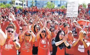  ??  ?? Teachers chant Thursday as they continue to protest at the Arizona Capitol in Phoenix. After an all-night legislativ­e budget session, the Legislatur­e passed the new education spending portion of the budget and it was signed by Gov. Doug Ducey.