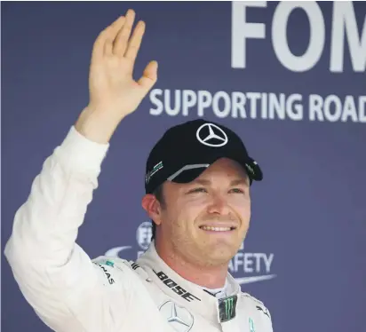  ??  ?? Nico Rosberg waves to the fans after claiming the Hungarian GP pole