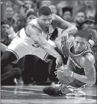  ?? AP/ CHARLES KRUPA ?? Washington guard Bradley Beal ( right) pulls the ball away from Boston defender Marcus Smart during the second quarter Monday. Beal fi nished with 38 points, including 24 in the second half, but it wasn’t enough to carry the Wizards to victory.