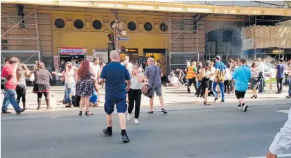  ?? Pictures / AAP ?? Bystanders said the vehicle did not slow down as it drove into people outside Flinders Street station. The two men in the car were said to be relatives.