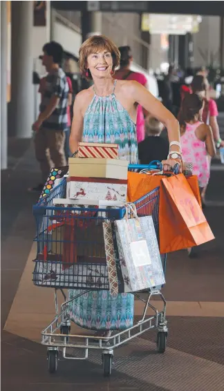  ?? Picture: GLENN HAMPSON ?? Donelle Coulter loads up with goodies at Robina Town Centre.