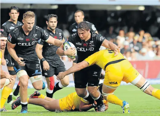  ?? Picture: GALLO IMAGES ?? ROADBLOCK: Etienne Oosthuizen of the Sharks is tackled by Matias Alemanno of the Jaguares during their Super Rugby match in Durban yesterday
