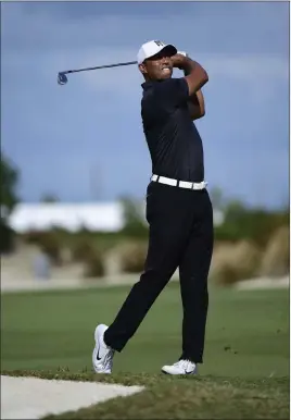  ?? Dante Carrer ?? The Associated Press Tiger Woods, tied for eighth in the Hero World Challenge, said he was happy to be three strokes out of the lead after his long layoff.