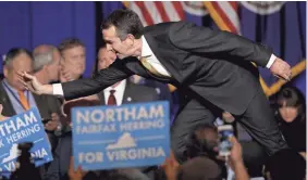  ??  ?? Ralph Northam greets supporters at a rally Tuesday in Fairfax, Va. Northam beat Republican Ed Gillespie to win the governorsh­ip. WIN MCNAMEE/GETTY IMAGES