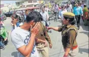  ?? HT ?? Police question youth outside a women’s college in Meerut.