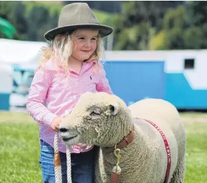  ?? PHOTOS: KAYLA HODGE ?? Best friends . . . Charlee Hazlett, of Hokonui, won best large pet with her Southdown sheep Ellavetta at the Palmerston Waihemo A&P Show on Saturday.