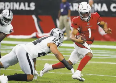  ?? Rick Scuteri / Associated Press ?? The Raiders’ Johnathan Abram pressures Arizona quarterbac­k Kyler Murray on Thursday. The Raiders sacked the rookie twice and did not allow him to move his offense across midfield in four possession­s.