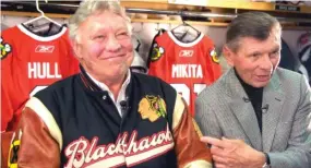  ?? SUN-TIMES ?? Statues of Stan Mikita (right) and Bobby Hull were unveiled at the UC in 2011.