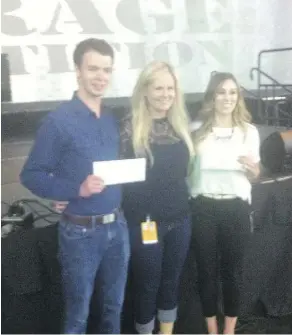  ??  ?? Alex Villeneuve of Ceres Solutions, left, with competitio­n judge Erika Murray, centre, and Andree Vincent of ezReferral at the Edmonton CNE Innovation Garage competitio­n for entreprene­urs on Sunday.