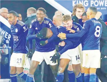  ??  ?? Leicester City’s Nigerian stars, Wilfred Ndidi and Kelechi Iheanacho (centre) celebrate with teammates during their English Premier League match against Everton at King Power Stadium…on Sunday.
PHOTO: AFP