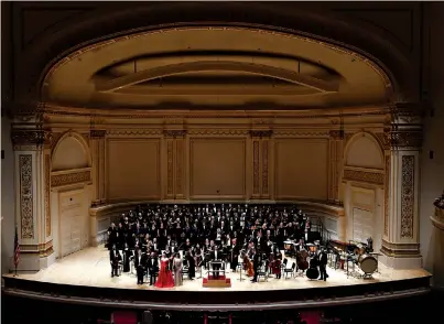  ?? Photo courtesy Group Photos Inc. ?? ■ The Texarkana Regional Chorale, along with a number of area choirs, pose for a photo onstage at Carnegie Hall in New York City. The ensemble performed Haydn’s “Mariazell Mass” on Saturday at the legendary theater.