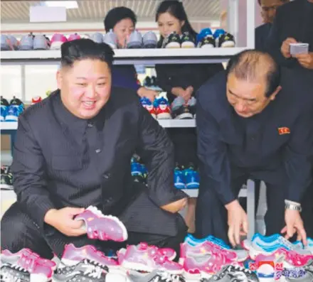  ??  ?? A Korean Central News Agency image shows Kim Jong-un inspecting a North Korean shoe factory.