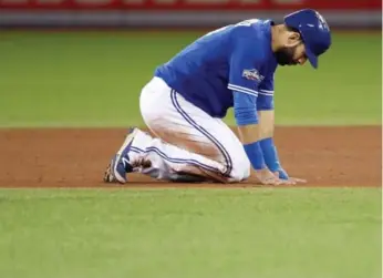  ?? RICHARD LAUTENS/TORONTO STAR ?? A dejected Jose Bautista kneels on the base path after being thrown out at second base during the sixth inning.