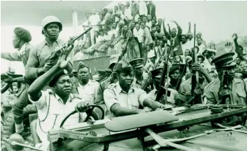  ??  ?? No buffoon: Major General Idi Amin, driving his own jeep amid rapturous supporters after overthrowi­ng Milton Obote