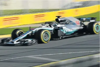  ?? Picture: AFP PHOTO/PAUL CROCK ?? FLASH AND BLUR: Mercedes’ British driver Lewis Hamilton during the Formula One Australian Grand Prix in Melbourne