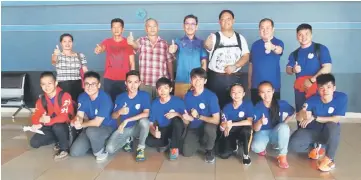  ??  ?? WFS president Allen Wong Siew Poh (centre), Ting (third right), coaches, athletes and their parents gesture during the sending- off of the team at the KIA yesterday.