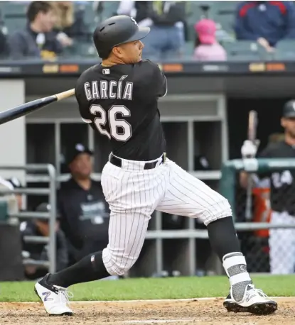  ?? JONATHAN DANIEL/ GETTY IMAGES ?? Avisail Garcia, back from a hamstring injury he suffered in April, singles in the sixth inning of Game 1.