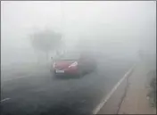  ??  ?? Vehicles plying on the RohtakDelh­i road amid dense fog. Farmers say the delay in sowing may bring down the per acre yield of wheat by 45 quintals. HT FILE