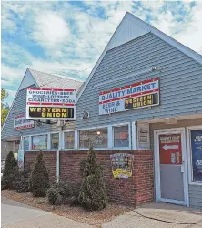  ?? STAFF PHOTOS BY MATT STONE ?? ‘EGREGIOUS INFRACTION’: The owner of two package stores was ticketed after police saw a photo of him loading up a truck at Quality Market, right, with beer to take to Quality Liquors, left.