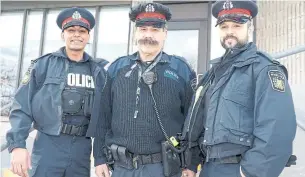  ?? BRYON JOHNSON/METROLAND ?? Cadet Daniel Sheikh, Sergeant John Rocha and Const. Matthew Pitula outside 12 Division.