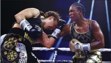  ?? ASSOCIATED PRESS FILE PHOTO ?? Claressa Shields, right, punches Ivana Habazin during the seventh round of a women’s 154-pound title boxing bout in Atlantic City, N.J. earlier this year.