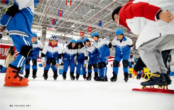 ?? by Zhang Ye/china Pictorial ?? Students from the No. 8 Middle School in Yanqing District, Beijing, attend a skating class at a local skating hall. According to statistics from Yanqing District, by the end of November 2021, about 28,500 primary and middle school students in the district had learned skiing and skating skills through populariza­tion of ice and snow sports classes.