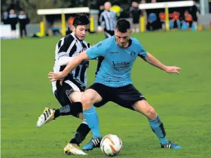  ?? Paul Watson ?? Runcorn’s Joe Heath shields the ball from a Barnton opponent in the teams’ Easter Sunday evening encounter at Pavilions.