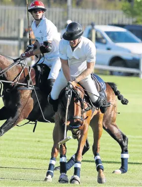  ?? Pictures: ESA ALEXANDER ?? Prince Harry caused gasps and the odd giggle during the Sentebale Royal Salute Polo Cup match at the Val de Vie Estate in Paarl, Cape Town, yesterday as he took a tumble from his horse, above and below. The game came to a brief halt as the young royal...