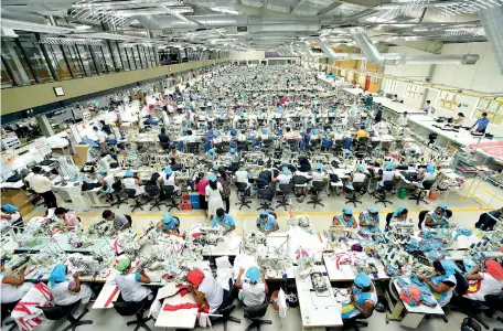  ??  ?? File picture of a garments factory which uses lot of imported raw material.