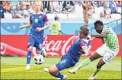  ??  ?? Nigeria's forward Ahmed Musa (R) scores his first goal against Iceland.