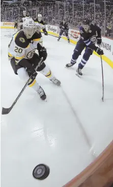  ?? AP PHOTO ?? ON THE LOOSE: Riley Nash and Patrik Laine go for a loose puck during last night’s game in Winnipeg.